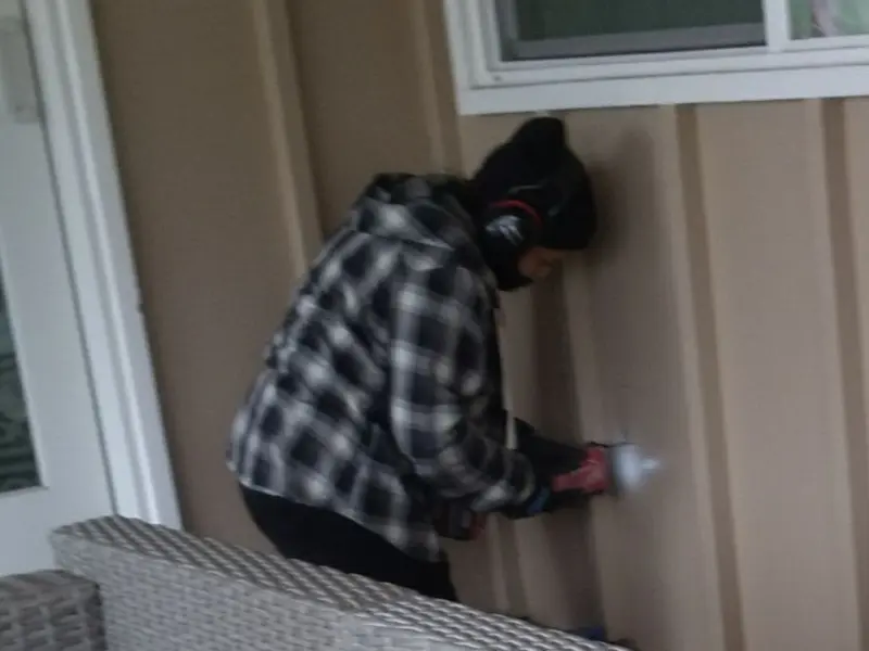 Professional electrician installing an exterior outlet in Senatobia